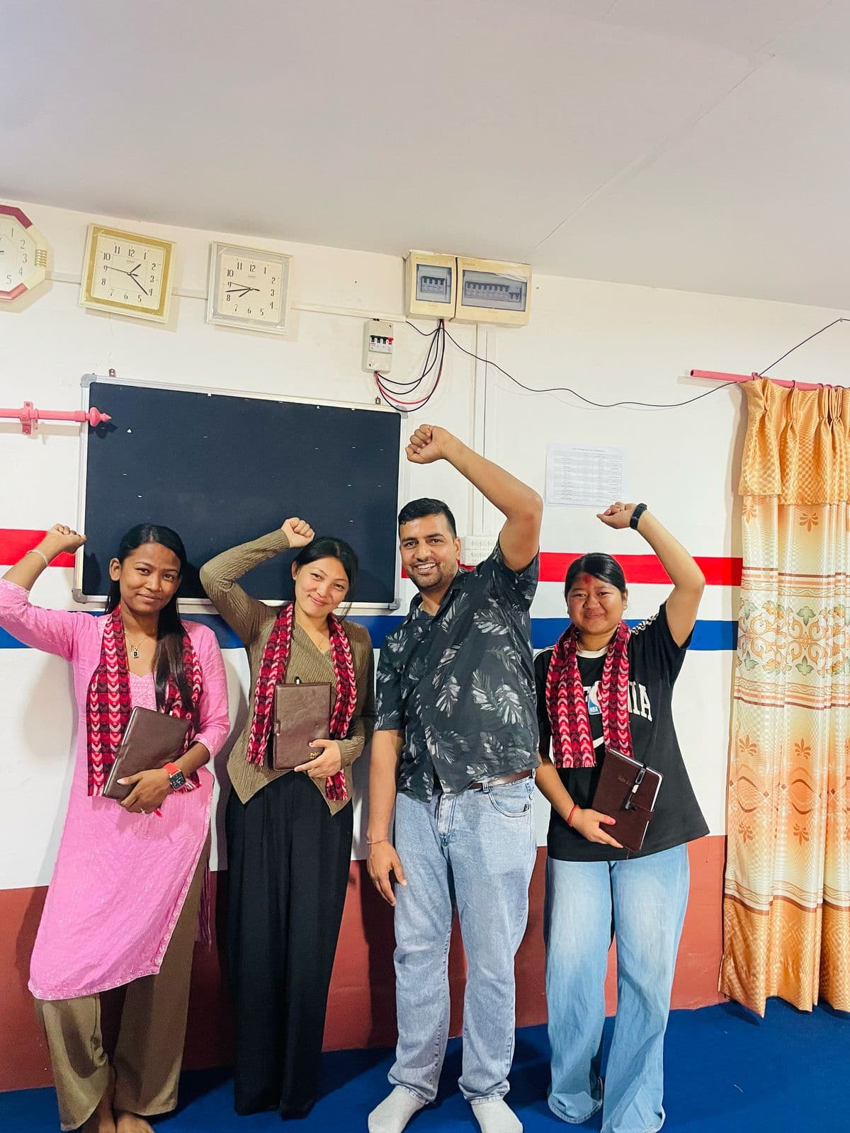 Students in traditional scarves at a farewell gathering before Japan